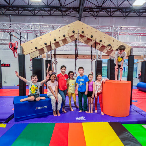 A group of kids enjoying ninja obstacle fun and fitness at summer camp in Stafford VA